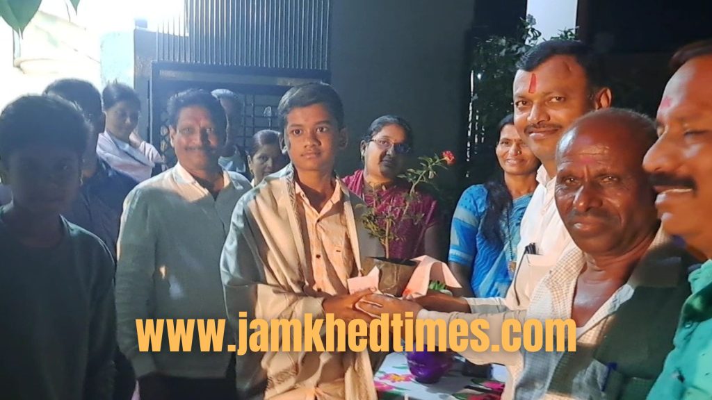 Honoring meritorious students in NMMS exam with teacher winning Adarsh ​​Shikshak award from Sai Ganesh Mandal in jamkhed 